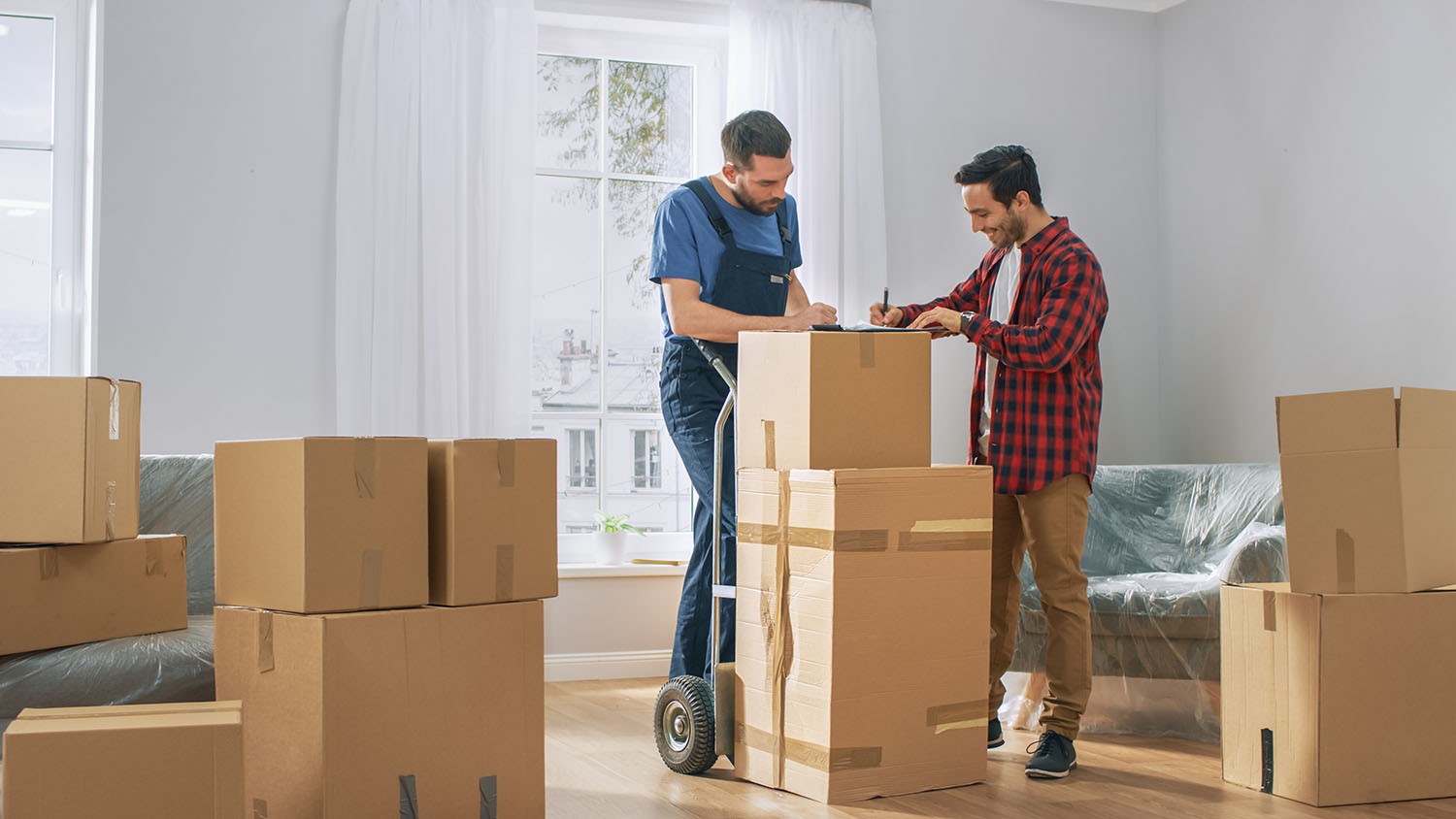 Happy New Homeowner Welcomes Professional Mover with Hand Truck