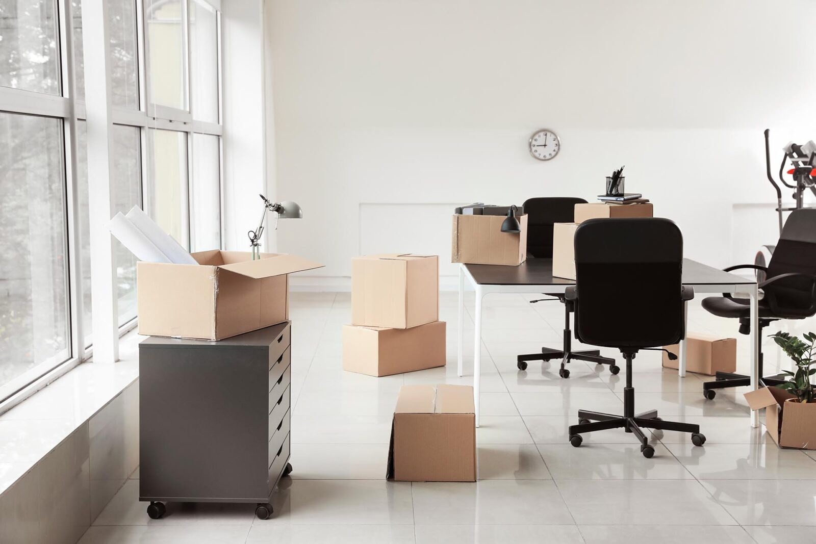 Cardboard,Boxes,With,Belongings,And,Furniture,In,New,Office,On